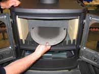 If you want to install the stove with the smoke exiting to the rear, knock the iron plates on the convection back panels out of the small