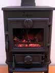 5. Refuelling of your stove should be done while there are still glowing embers in the bed. Spread the embers across the bottom, but concentrated mostly towards the front of the stove. 6.