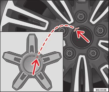 Anvisning I det bageste område af hjulkapslen er der også en dækventilmarkering, der viser den korrekte placering. Hjulkapsel til letmetalfælg* Fig.