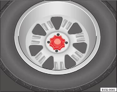 Anbefalinger 204 Reservehjul eller nødhjul* Fig. 177 I bagagerummet: håndhjul til fastgørelse af reservehjul Udtagning af reservehjul Åbn bagklappen, og klap bagagerumsafdækningen op Side 122.