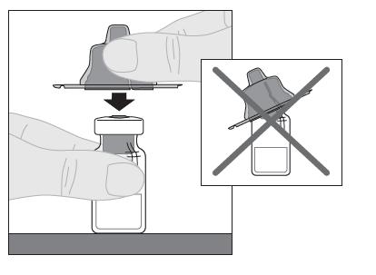 4. Tør toppen af hætteglasset af med en af spritservietterne (F), der fulgte med pakningen, og lad det lufttørre.